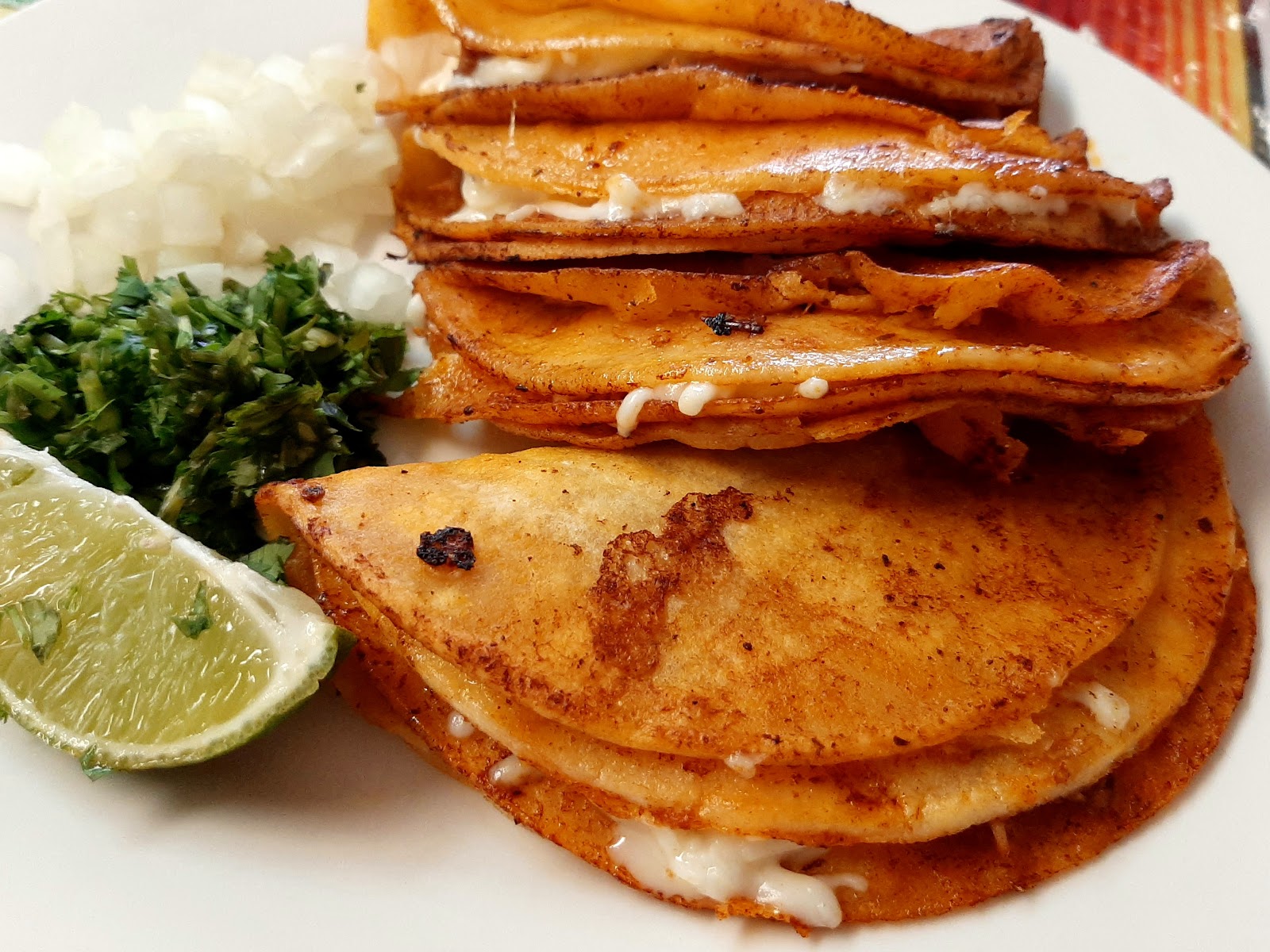 Crispy tacos with lime, onion and cilantro